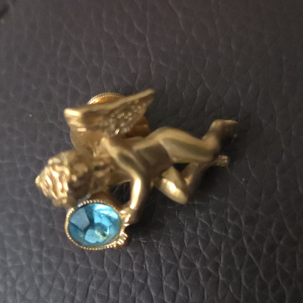 Angel Pin Holding an Aquamarine color round crystal - Avon